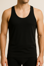 A male model wearing a black cotton sleeveless undershirt and boxers.