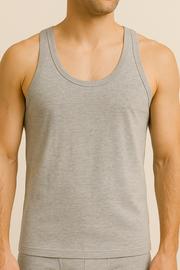 A male model wearing a gray cotton sleeveless undershirt and boxers.