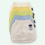 Baby Soft-Cuff Briefs, 100% Cotton, all colors stacked, on pastel mint background