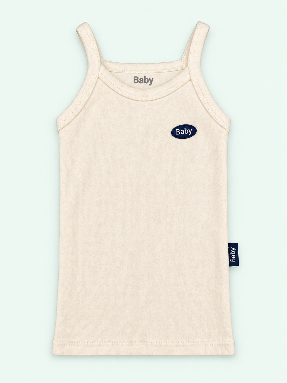 100% cotton baby thin-strap vest in cream with Baby label on pastel mint