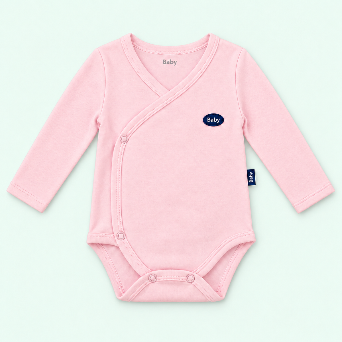 Baby long-sleeve wrap bodysuit in pink on pastel mint
