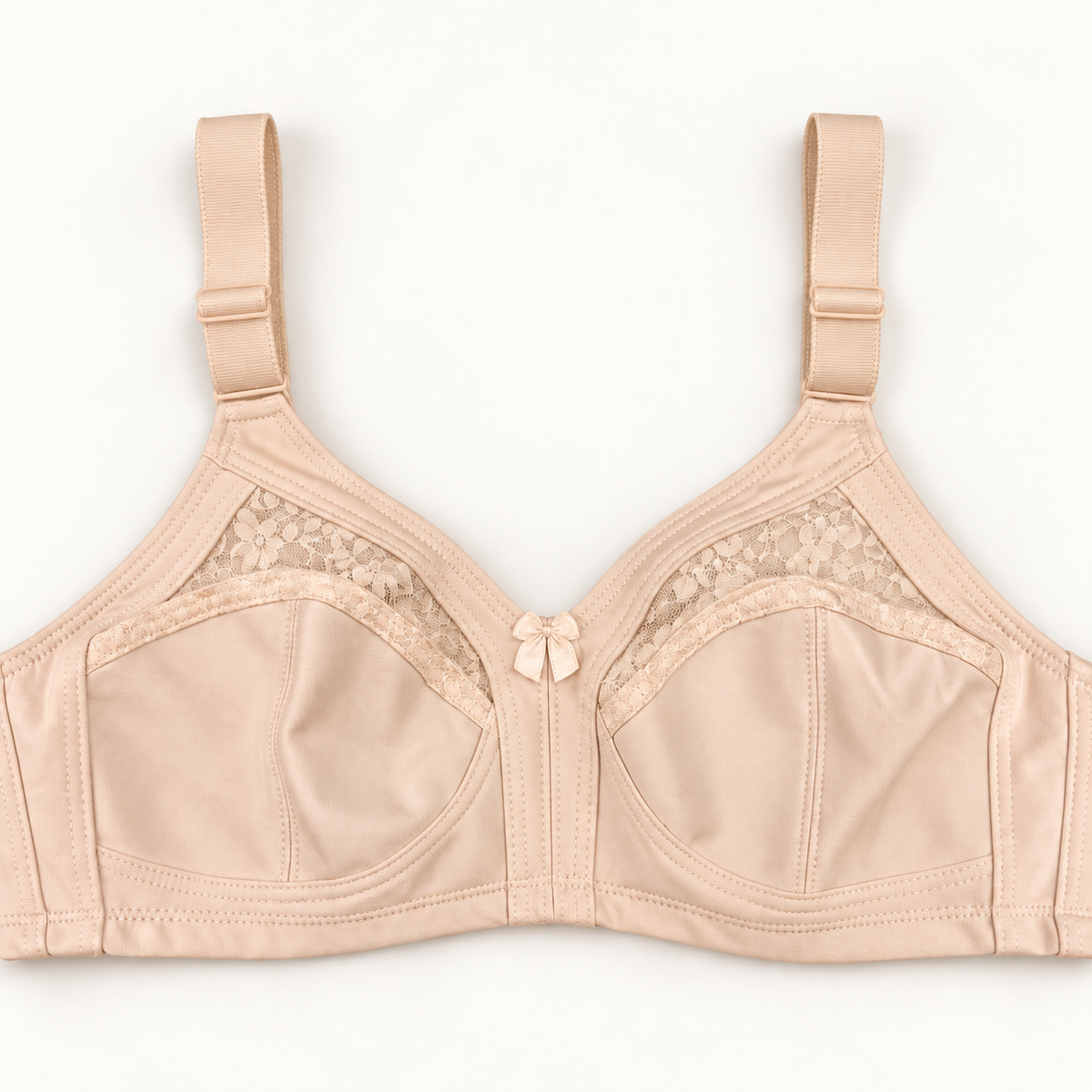 Beige non-padded bra with seamed cups, curved floral-lace inserts, wide adjustable straps and a small centre bow.