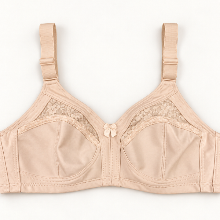 Beige non-padded bra with seamed cups, curved floral-lace inserts, wide adjustable straps and a small centre bow.