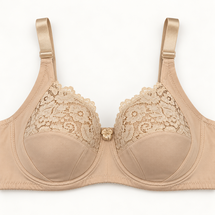 Light beige push-up bra with floral-lace upper cup panels and smooth seamed lower panels. Finished with wide straps and a centre bow.