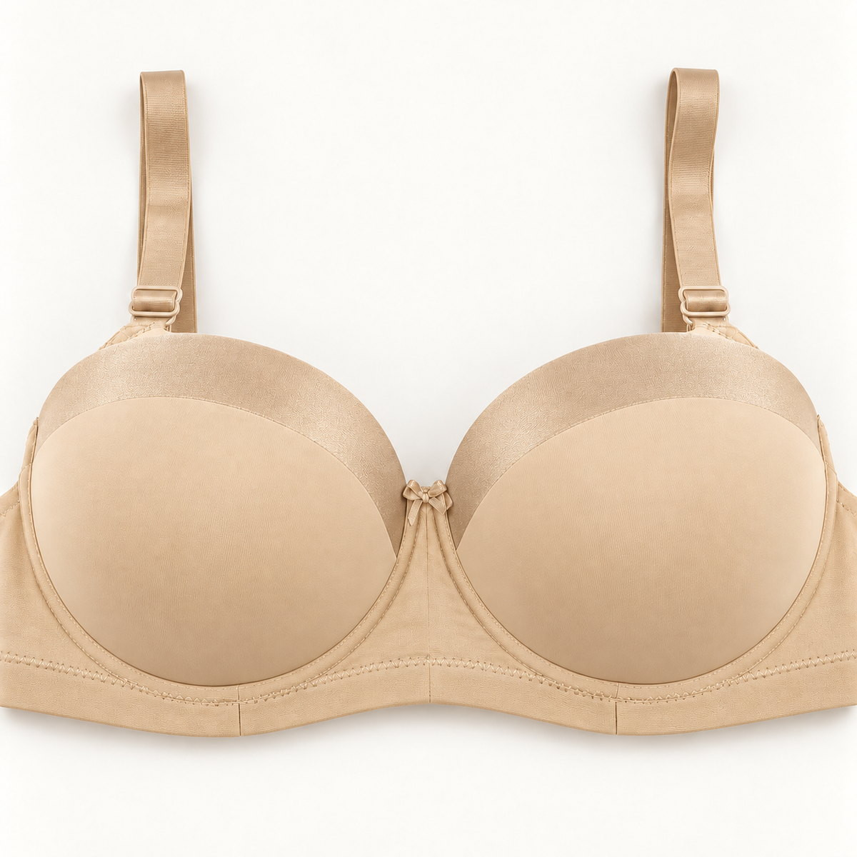Beige push-up bra with subtly contrasting champagne-beige curved panels along the upper cups. Finished with matching straps, a plain stitched band and a small centre bow.