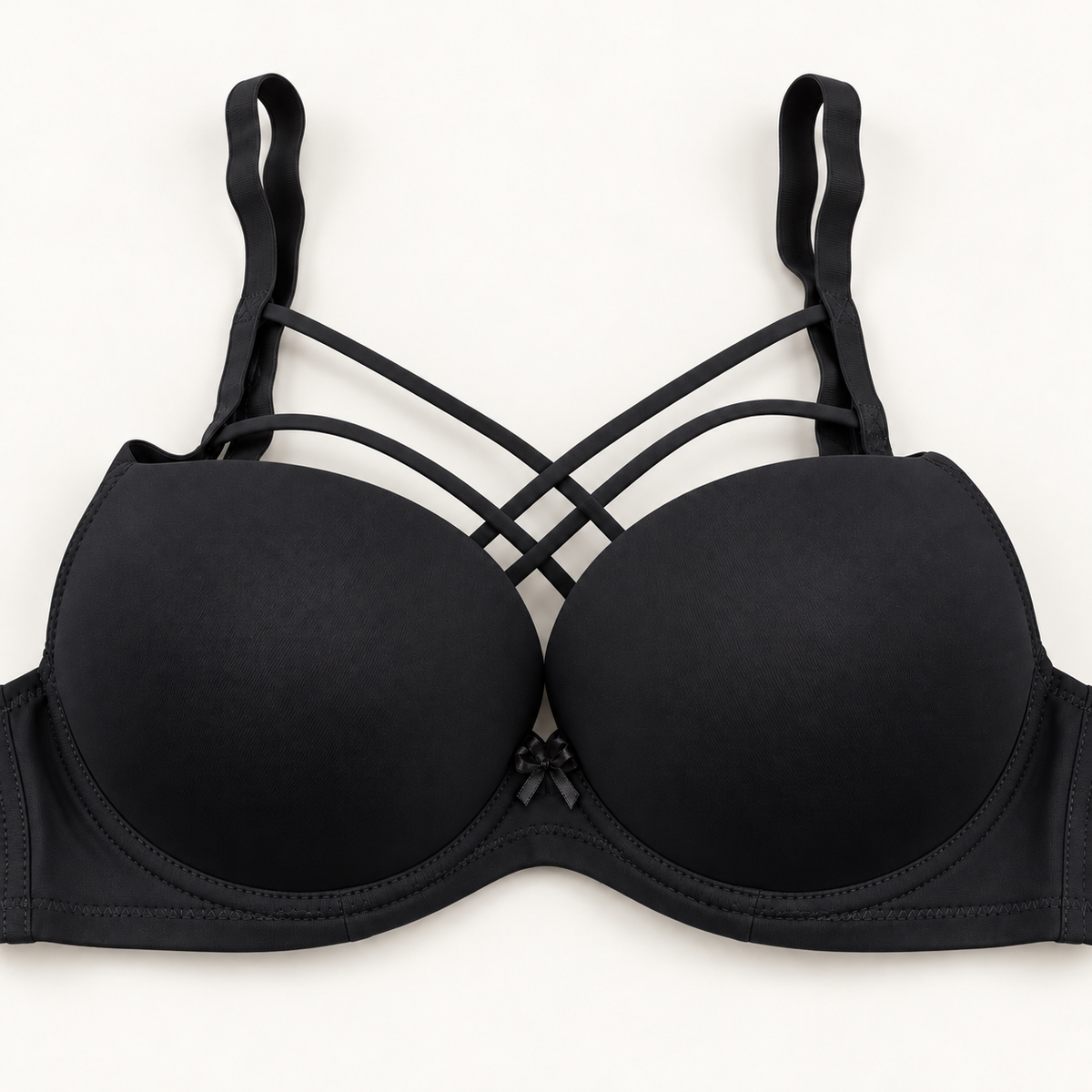 black cross-strap push-up bra with smooth cups, plain band and centre bow
