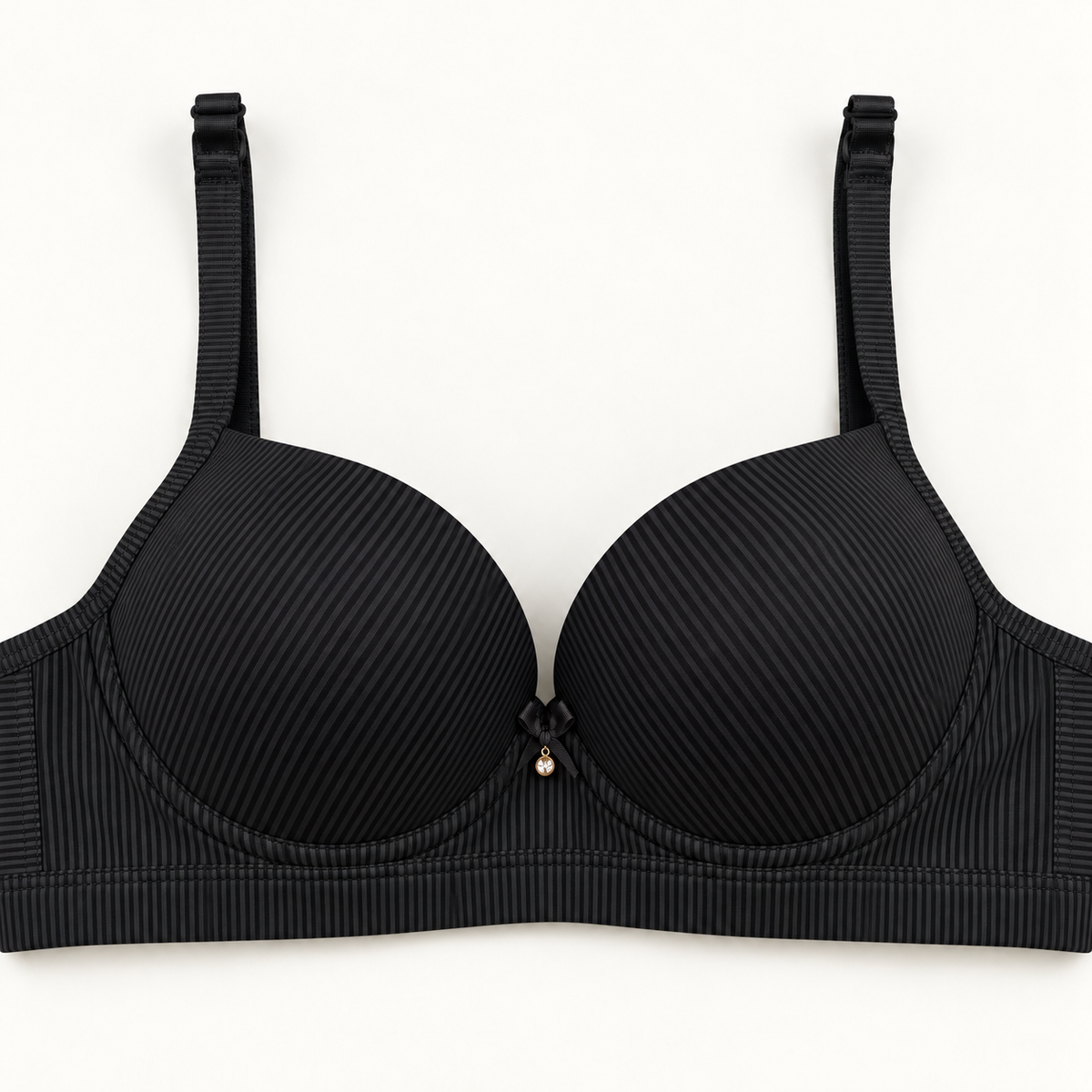 Black push-up bra with fine pinstripes and a small centre bow.