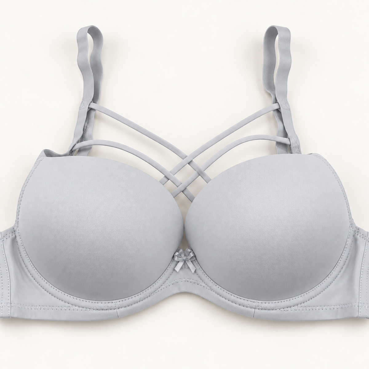 light grey cross-strap push-up bra with smooth cups, plain band and centre bow