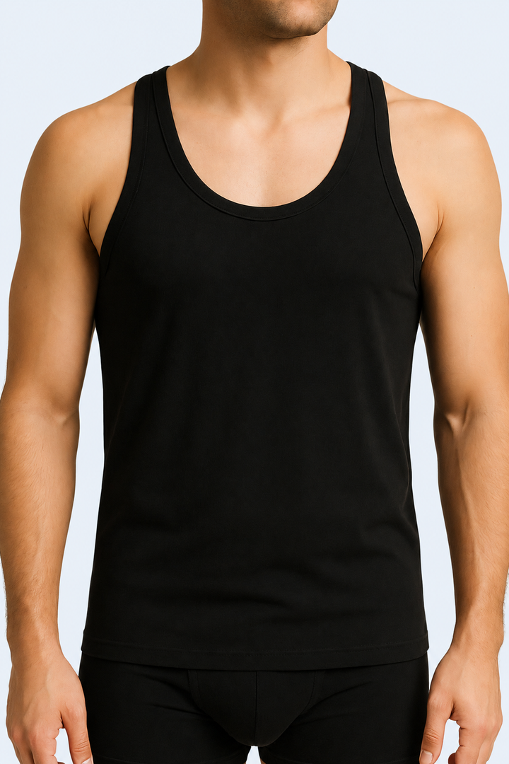 A male model wearing a black cotton sleeveless undershirt and boxers.