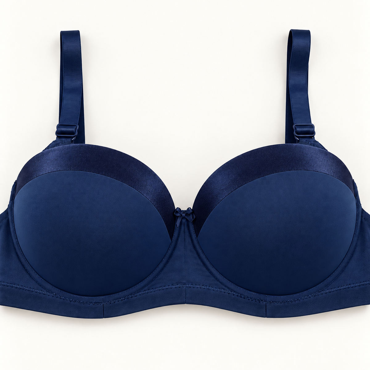 Navy blue push-up bra with darker curved panels along the upper cups. Finished with matching straps, a plain stitched band and a small centre bow.