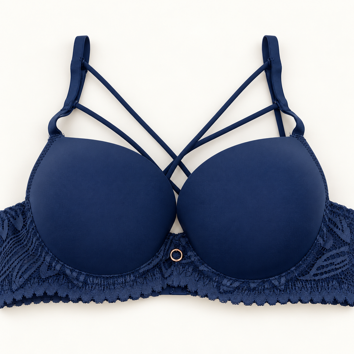 Navy push-up bra with crossed decorative straps, floral-lace band and centre ring detail.