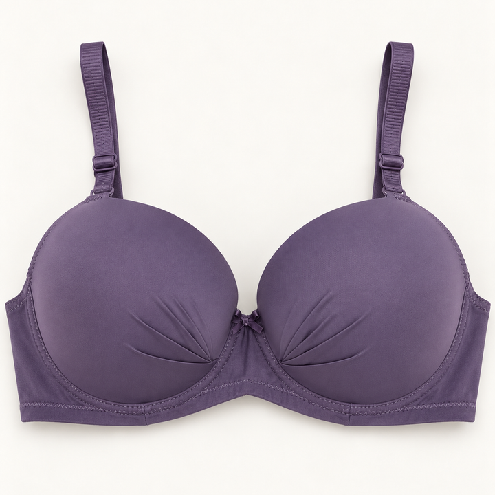 Muted purple push-up bra with small gathered folds toward the centre of each cup. Matching straps, a plain band and a centre bow complete the design.