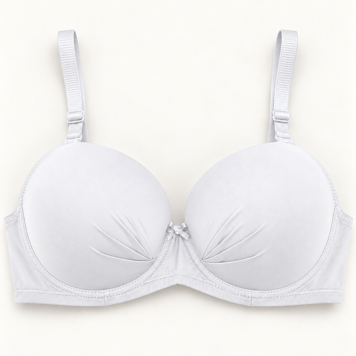 White gathered-cup unpadded push-up bra with matching straps and centre bow